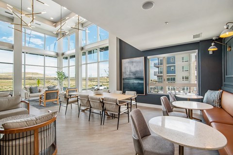 A modern cafe with a view of the city.