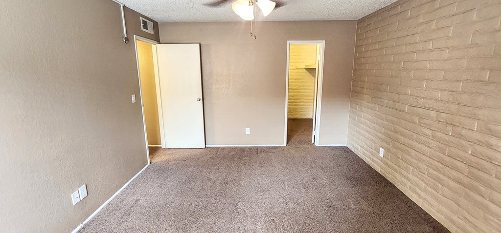1x1 Brown Upgrade Main Bedroom with Closet at Mission Palms Apartment Homes in Tucson AZ