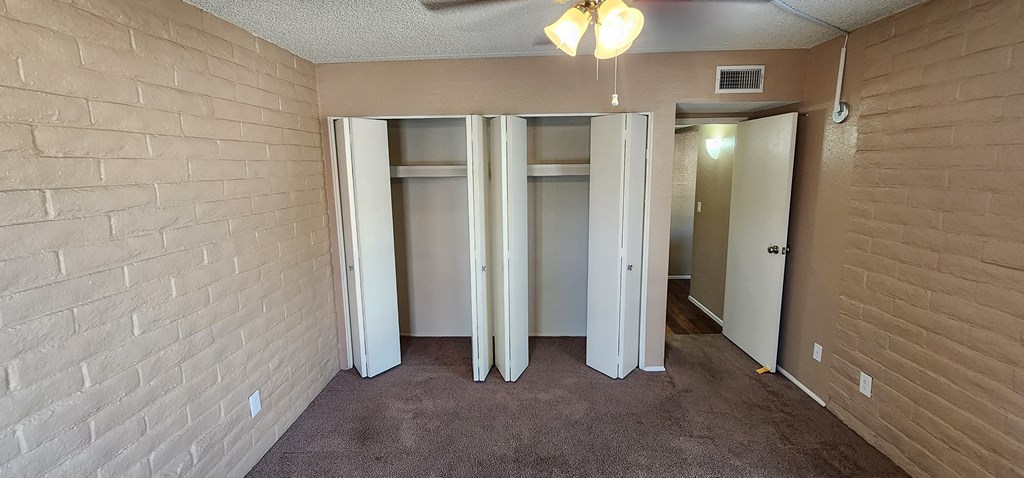 2x2 Downstairs Brown Upgrade Guest Bedroom with Closets at Mission Palms Apartment Homes in Tucson AZ