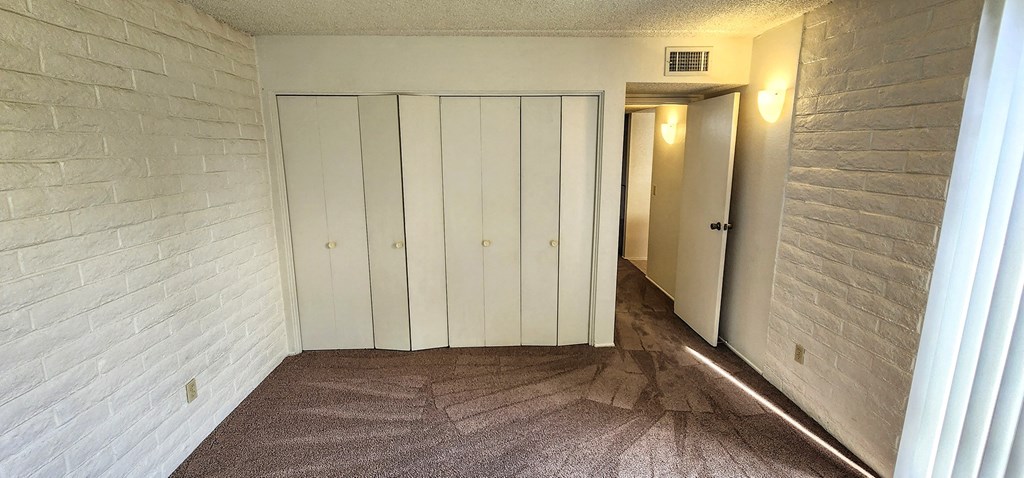 2x2 Downstairs Classic Guest Bedroom with Closets at Mission Palms Apartment Homes in Tucson AZ