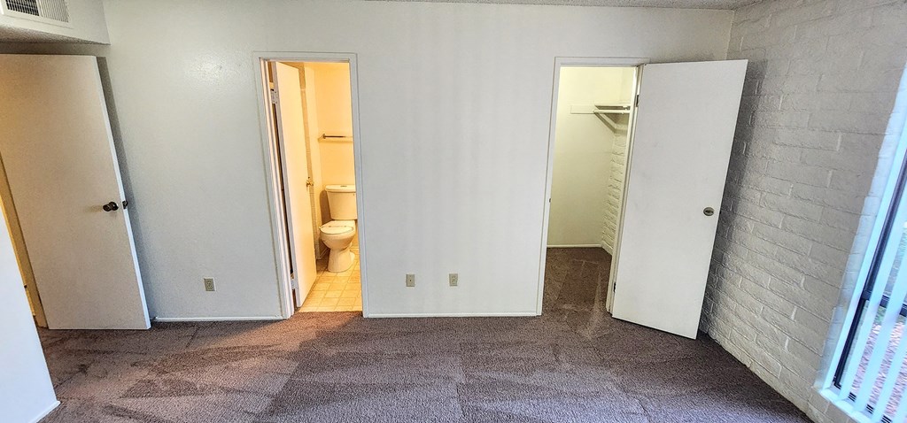 2x2 Downstairs Classic Main Bedroom with Closet and Bathroom at Mission Palms Apartment Homes in Tucson AZ.jpg