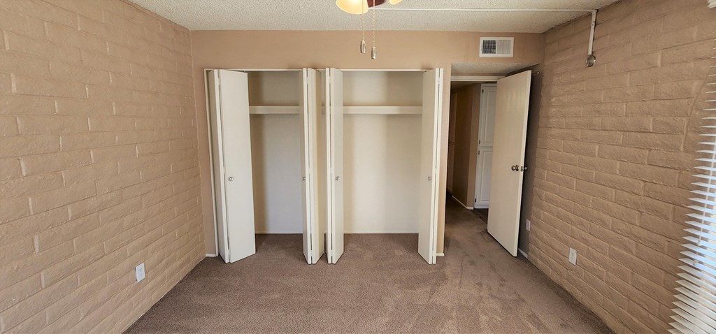 2x2 Upstairs Brown Upgrade Guest Bedroom with Closets at Mission Palms Apartment Homes in Tucson AZ