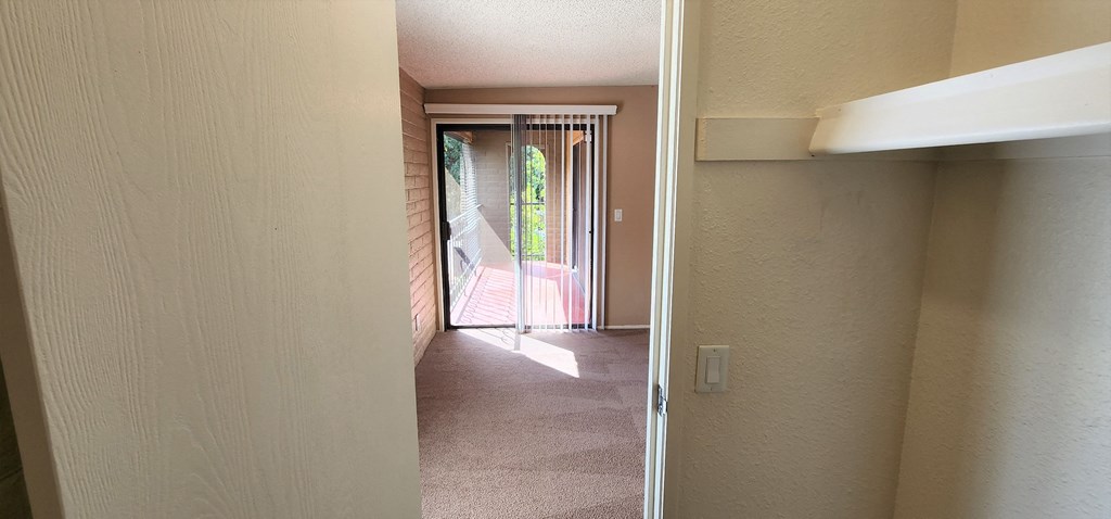 2x2 Upstairs Brown Upgrade Main Closet at Mission Palms Apartment Homes in Tucson AZ