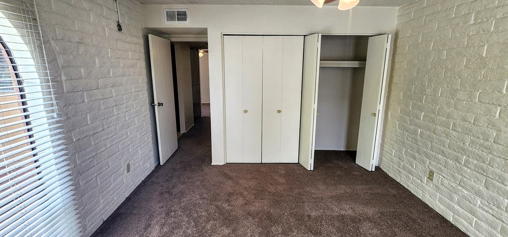 2x2 Upstairs Classic Guest Bedroom with Closets at Mission Palms Apartment Homes in Tucson AZ