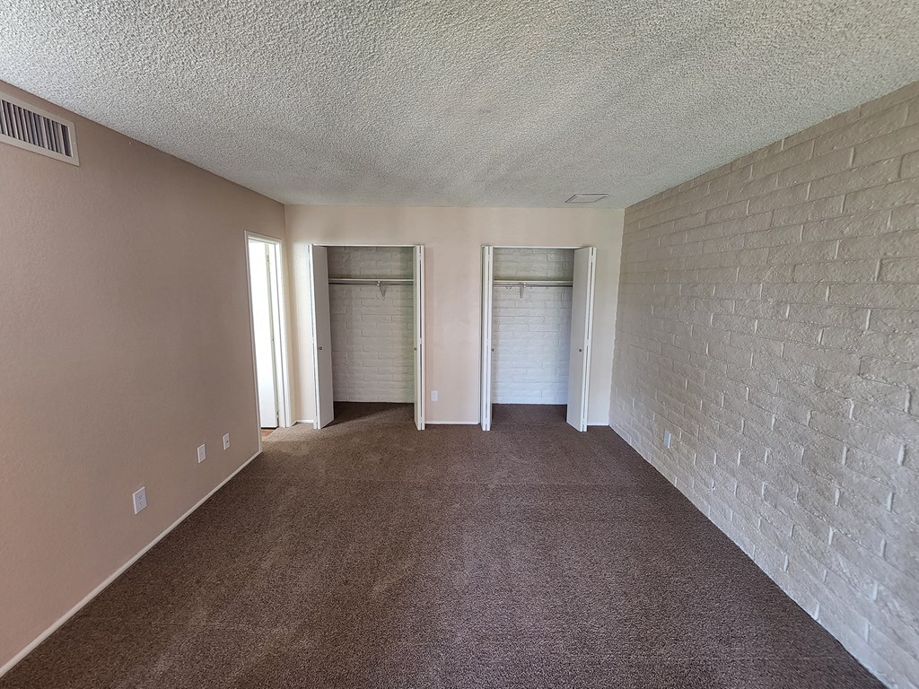 x2 and a half Bath Classic First Main Bedroom with Closets at Mission Palms Apartment Homes in Tucson AZ