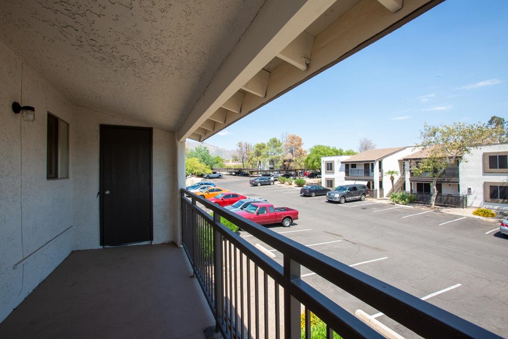 A red car is parked in a parking lot.