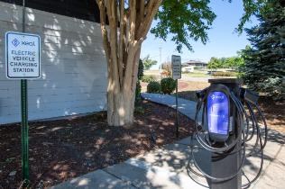 A charging station for electric vehicles is located outdoors.