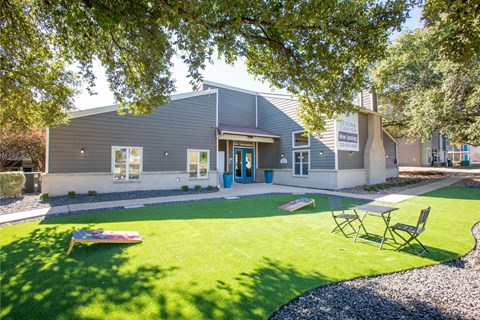 A building with a blue door and a sign that says "Welcome to our new community center".