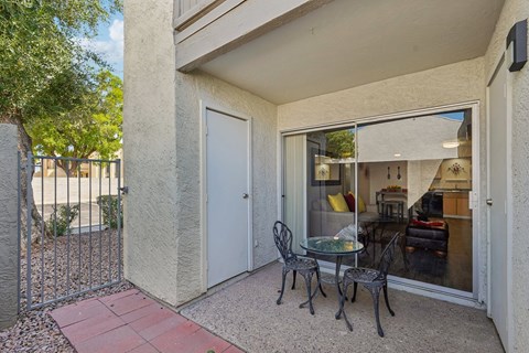 A patio with a table and chairs is shown.