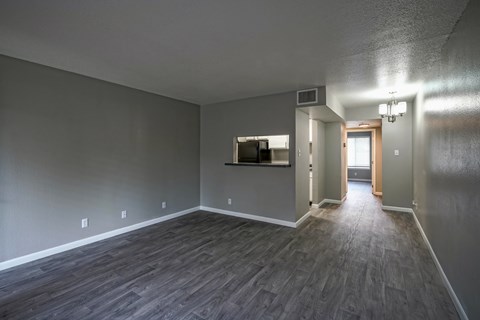 A room with grey walls and wooden flooring.
