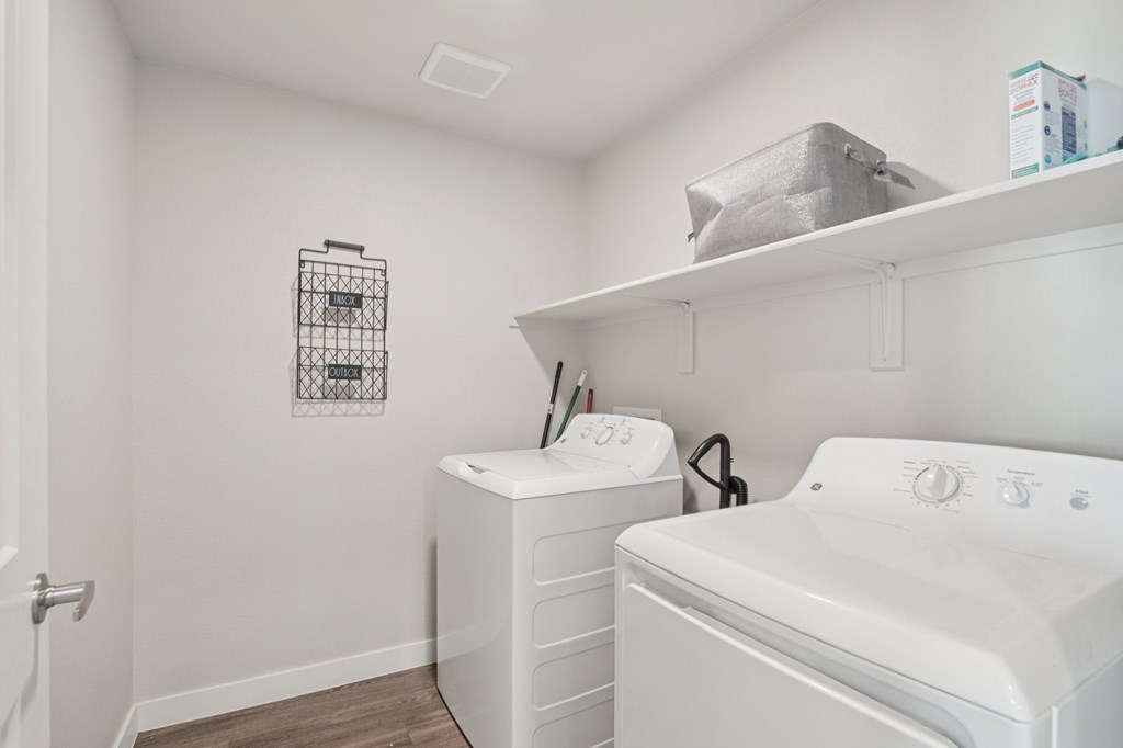 A laundry room with a washer and dryer.