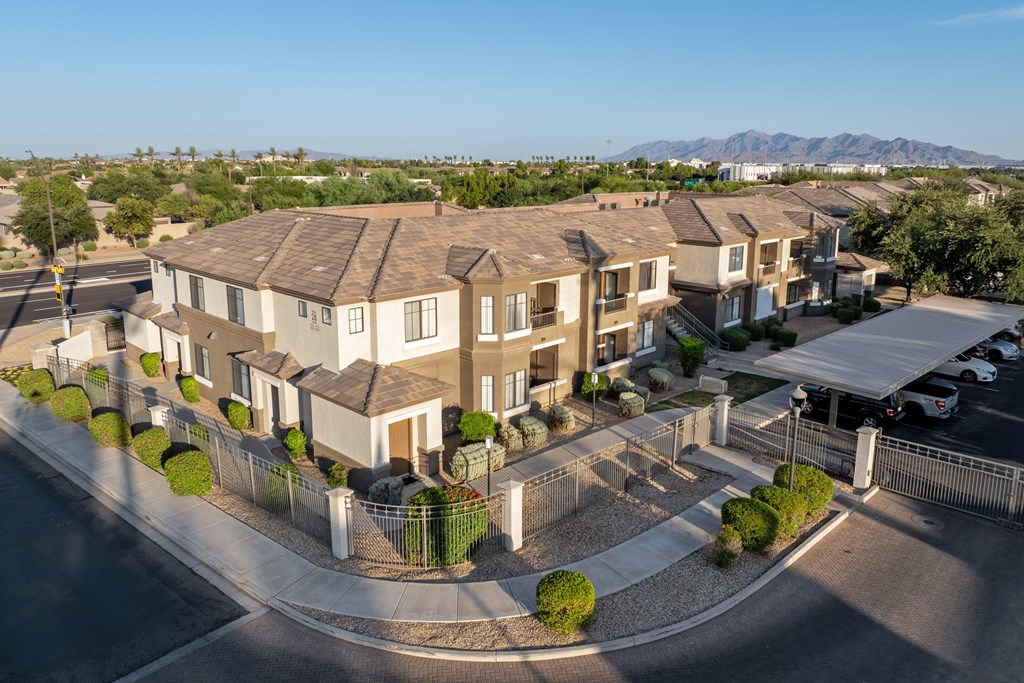 A row of houses with a mountain in the background.