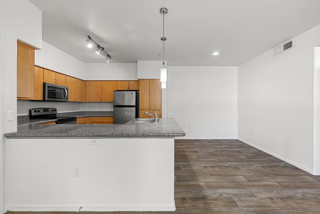A kitchen with a countertop and cabinets.