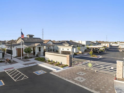 A parking lot with a handicap parking space in front of a building.