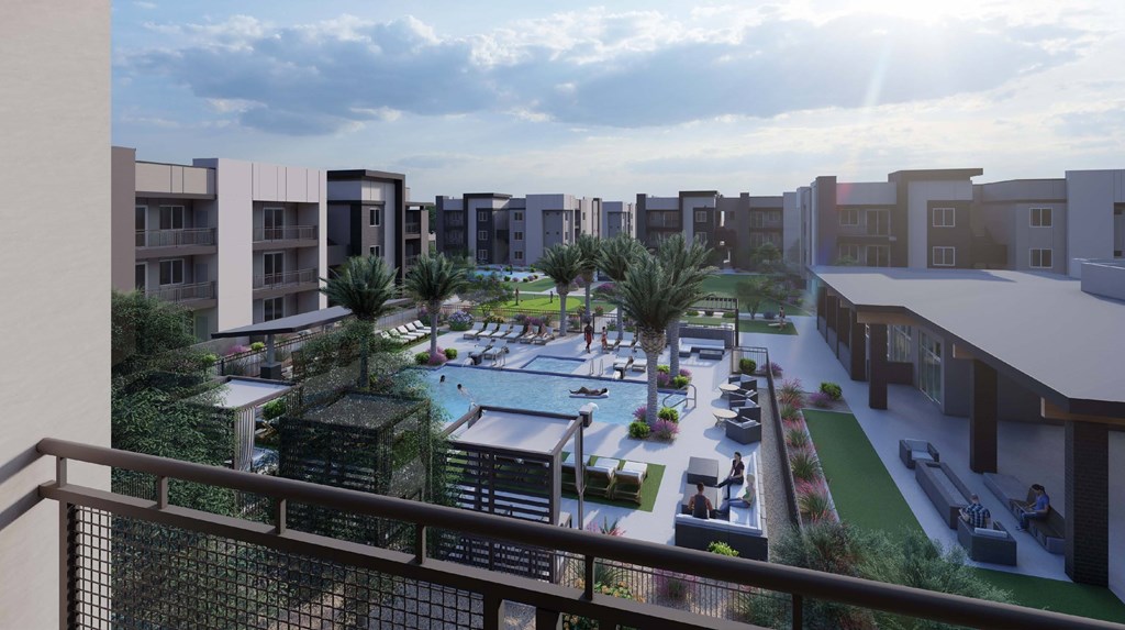 A sunny day at a resort with a pool and palm trees.