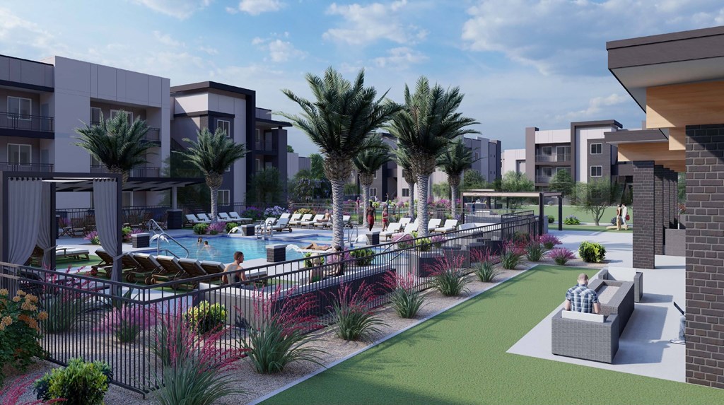 A modern residential area with a pool and palm trees.