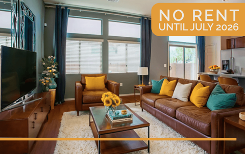 A living room with a sign that says "NO RENT UNTIL JULY 2026".