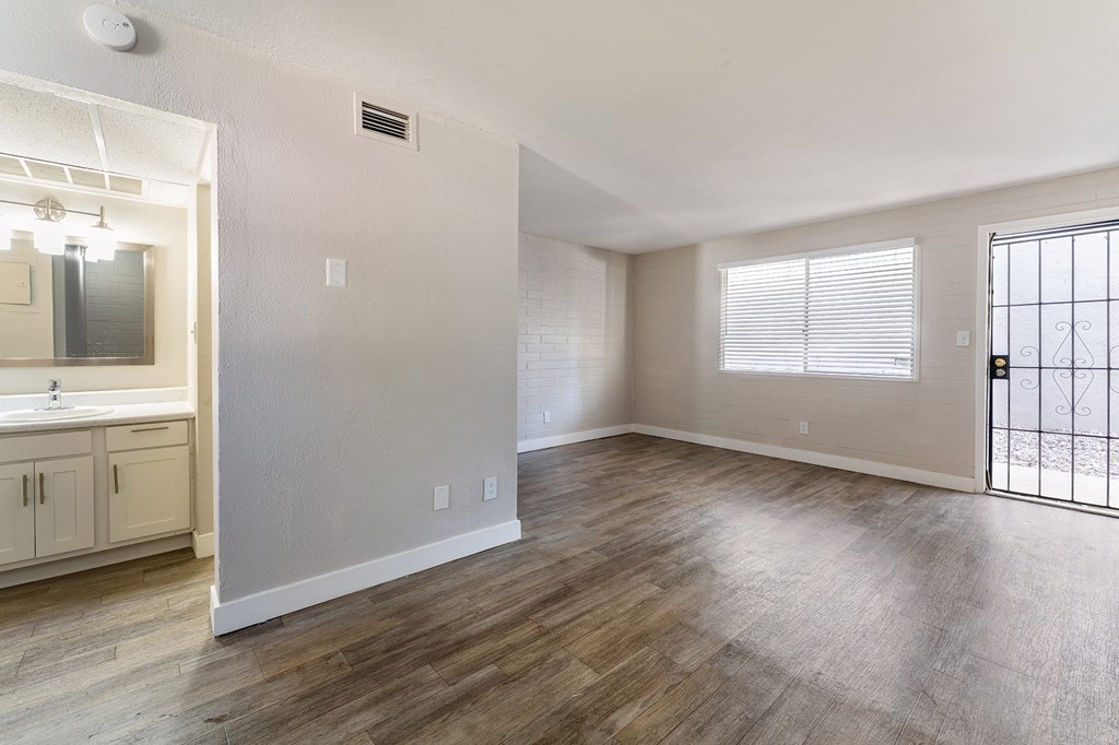 Bathroom Vanity and living room at Avani North Tucson Apartments in Tucson Arizona