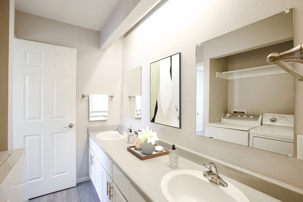 Bathroom with full size washer and dryer