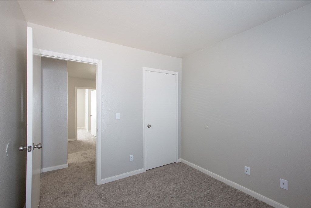 Bedroom and Hallway at The Bluffs at Tierra Contenta Apartments in Santa Fe New Mexico