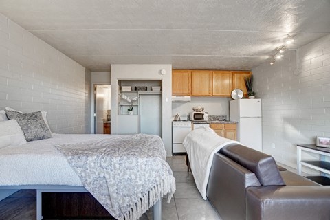 Bedroom & kitchen at University Manor Apartments in Tucson, AZ