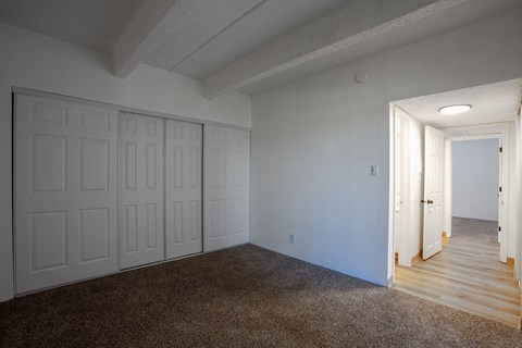 Bedroom with carpet at Los Altos Towers Apartments in Albuquerque NM
