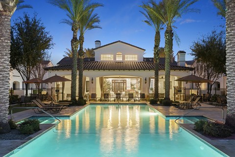 A large house with a pool in the backyard.