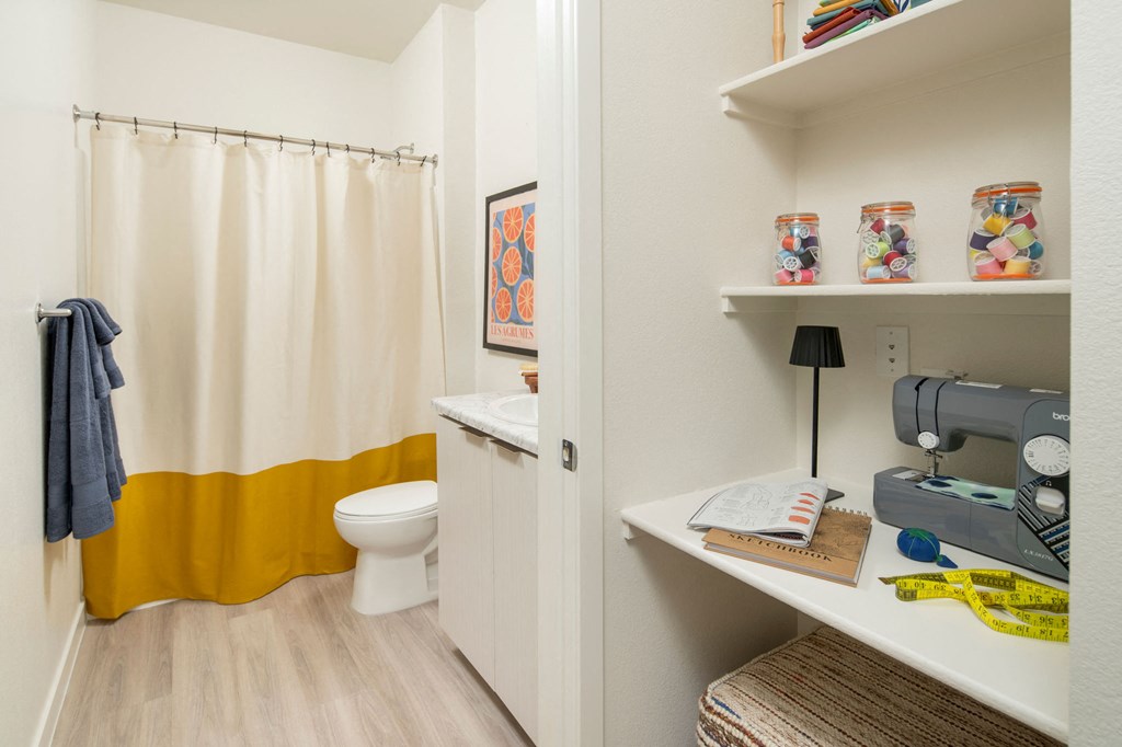 Built in desk and bathroom at Streamliner 16th Apartments in Phoenix