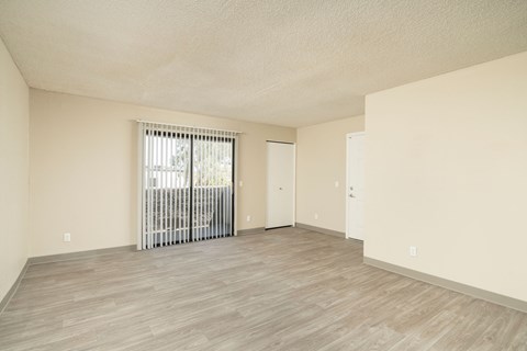 A room with a sliding door and a window.