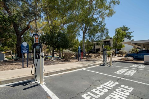 An electric vehicle charging station with a sign that says "Bluebonnet".