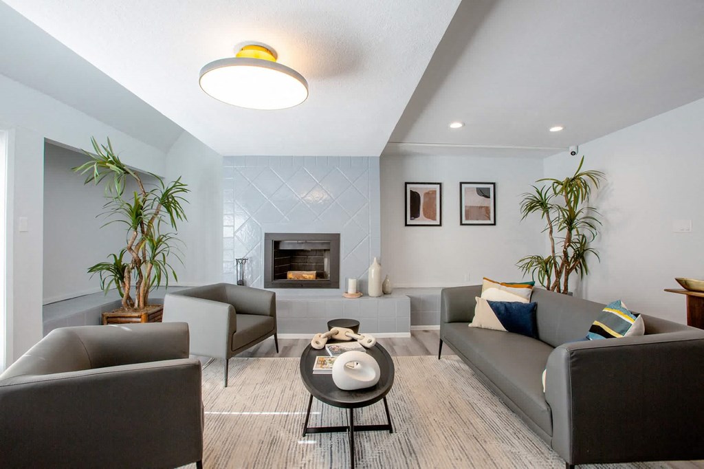 a living room with couches and a coffee table