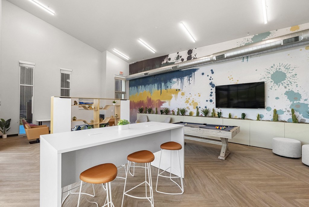 a living room with a white bar and stools at SECOND AVE COMMONS | BRAND-NEW, Mesa, Arizona