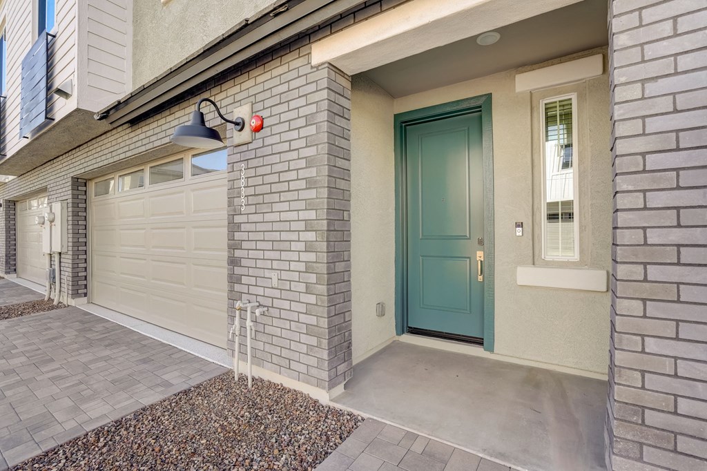 the front door of a home with a blue door
