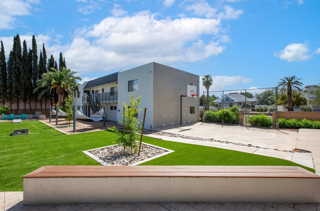 Corn Hole Game Area and Basketball Court at The Link at 4th Ave Apartments
