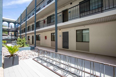 A building with a balcony and a bike rack