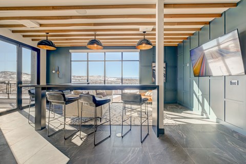 A modern dining area with a table and chairs.