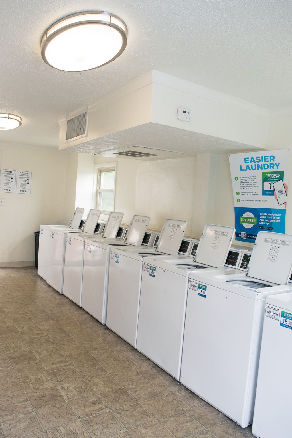 A laundromat with a sign that says "Easier Laundry".