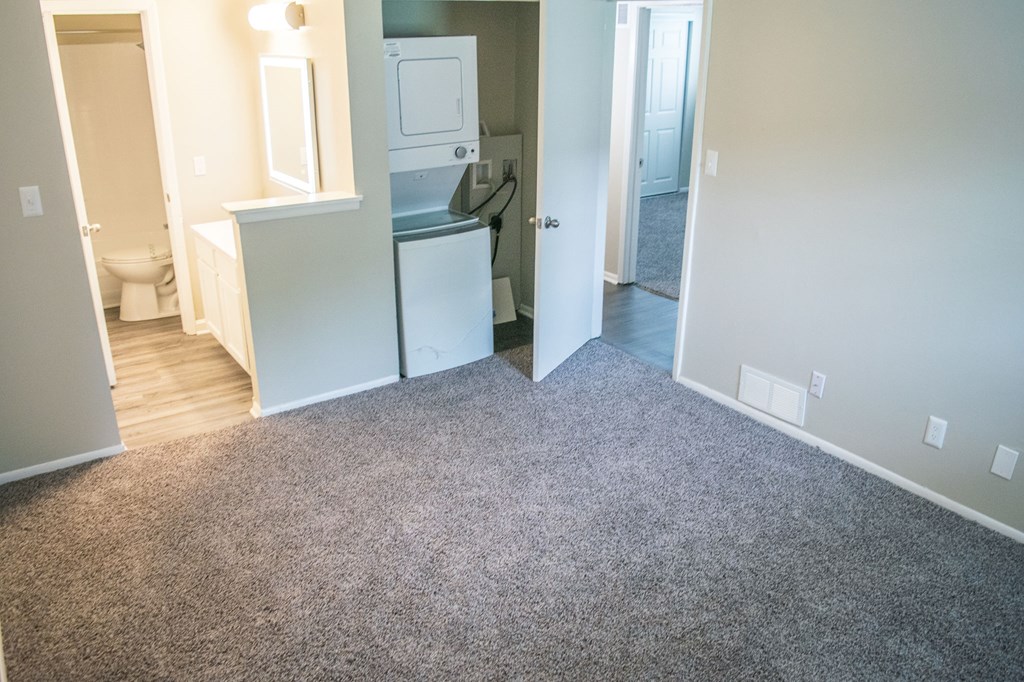 A room with a washer and dryer in it.