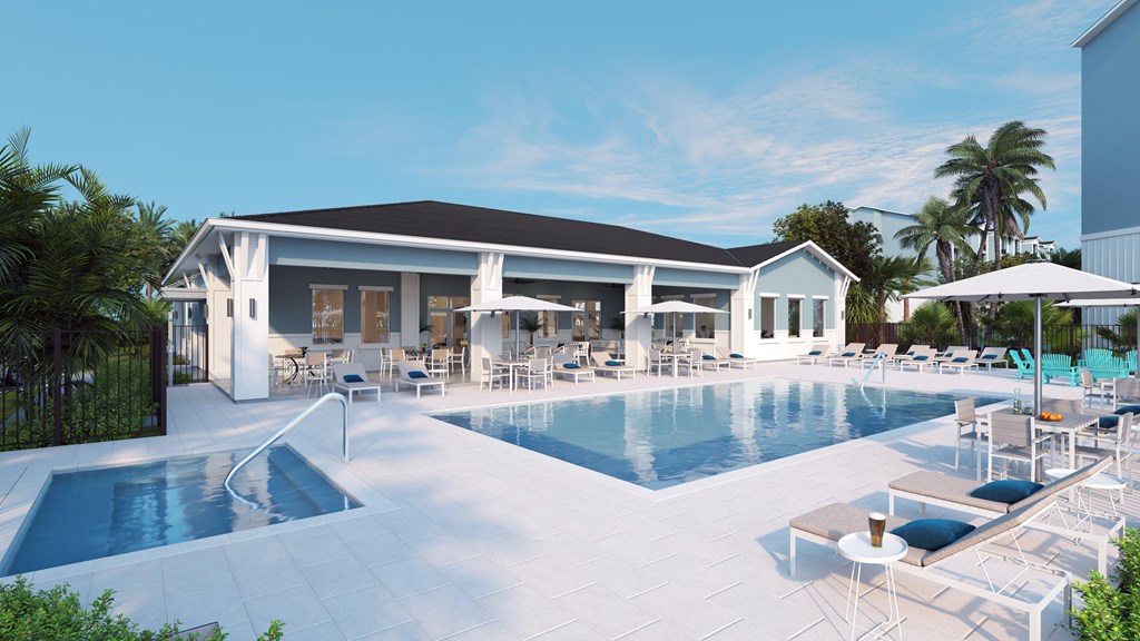 A large white building with a pool in front.