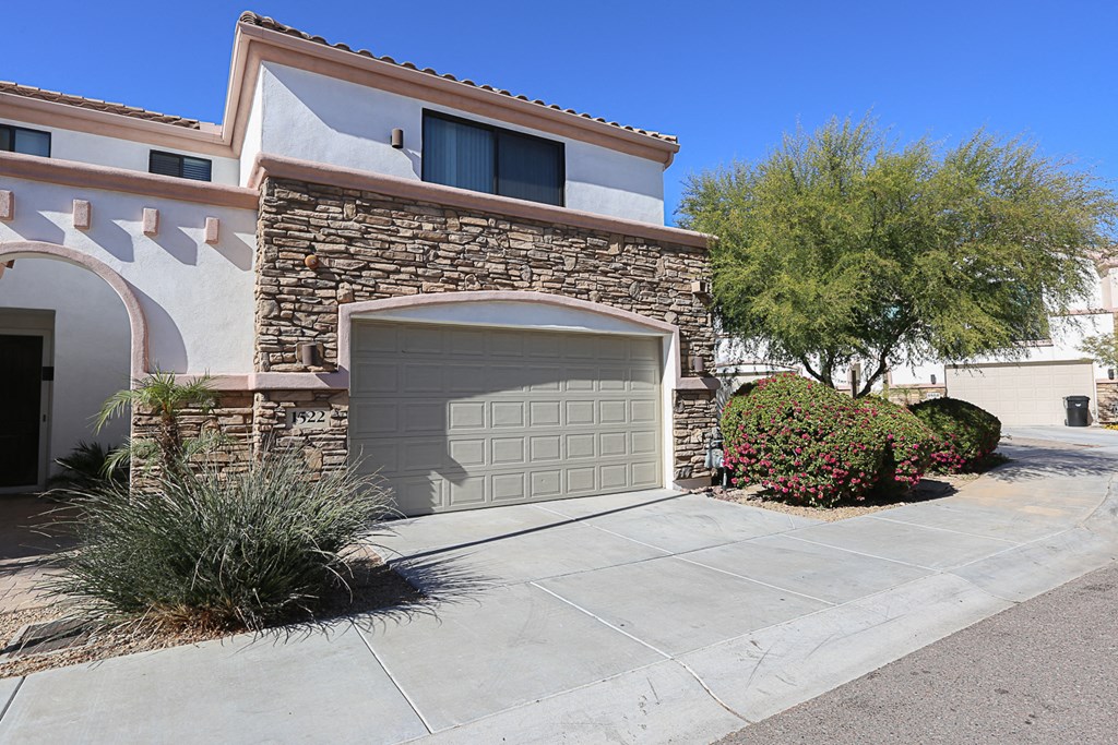 Exterior, Landscaping & Garage at Villa Contento Apartments in Scottsdale, AZ
