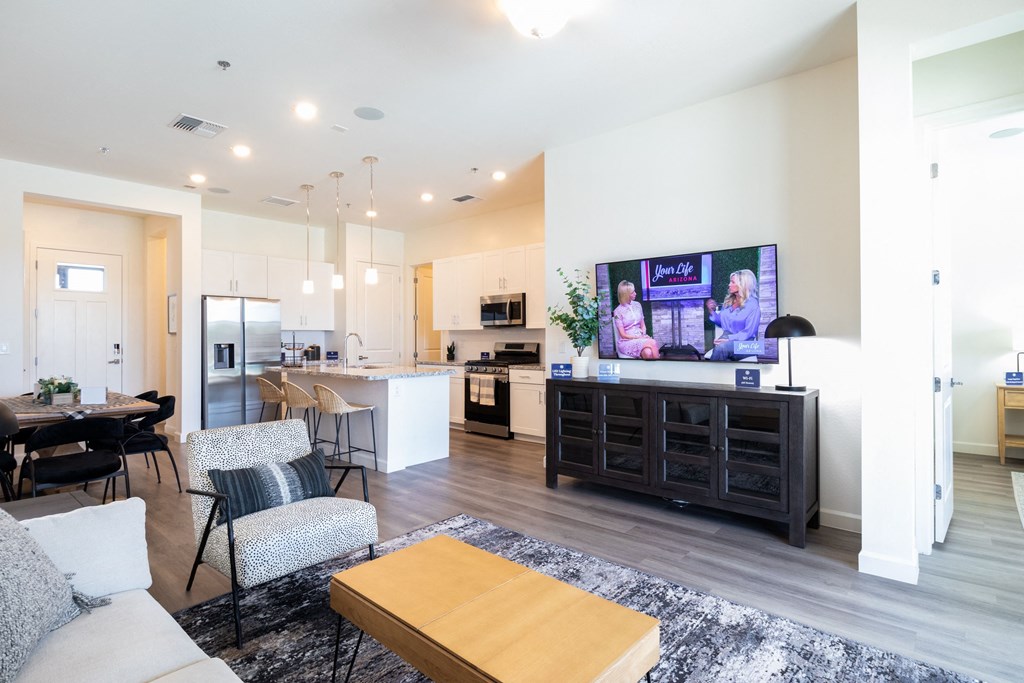 Indigo living room and kitchen area at Bella Encanta Apartments in Mesa AZ
