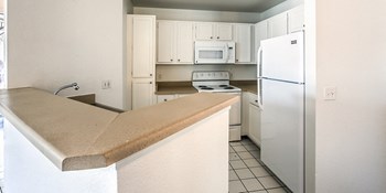 Kitchen & Breakfast Bar at Bella Vita in Bullhead City, AZ - Photo Gallery 6
