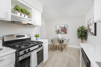 Kitchen and Dining Area at La Mirada Apartments - Photo Gallery 6