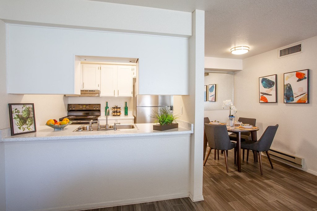 Kitchen and Dining Area at Whispering Sands Apartments in Albuquerque