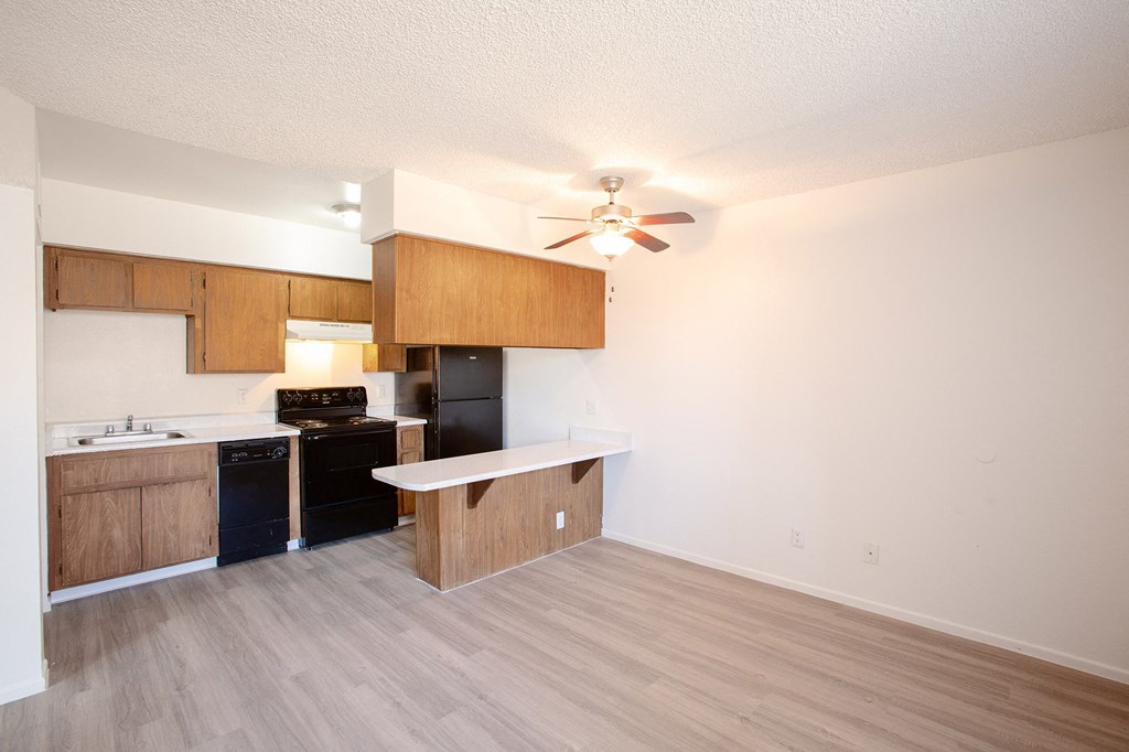 Kitchen and living room at La Lomita Apartments in Tucson Arizona