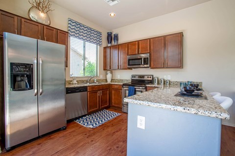 a kitchen with stainless steel appliances and a counter top