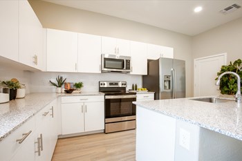 Kitchen at The Carson Townhome Apartments - Photo Gallery 24
