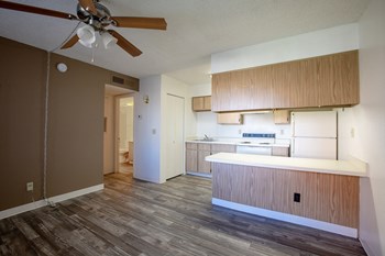 Kitchen with Breakfast Bar at Acacia Hills Apartments - Photo Gallery 13