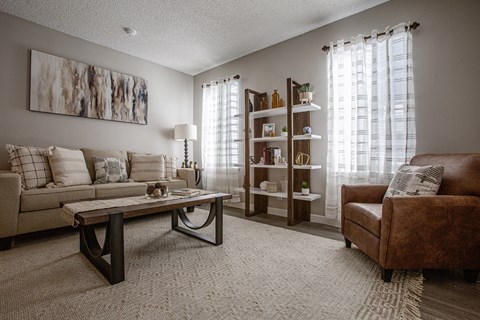 a living room with a couch and a chair