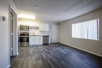 Living Room and Kitchen Area at The Link at 4th Ave Apartments - Photo Gallery 2